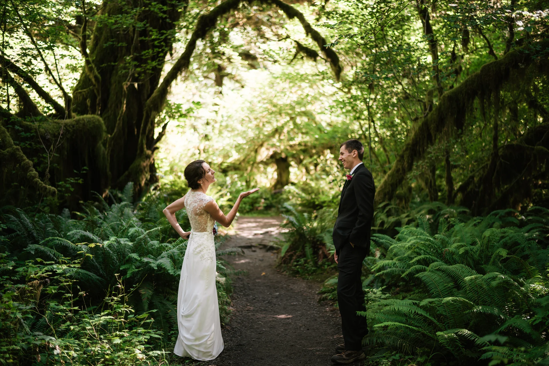 Playful couples blows kisses to each other during their wonderful elopement to Olympic National Park.