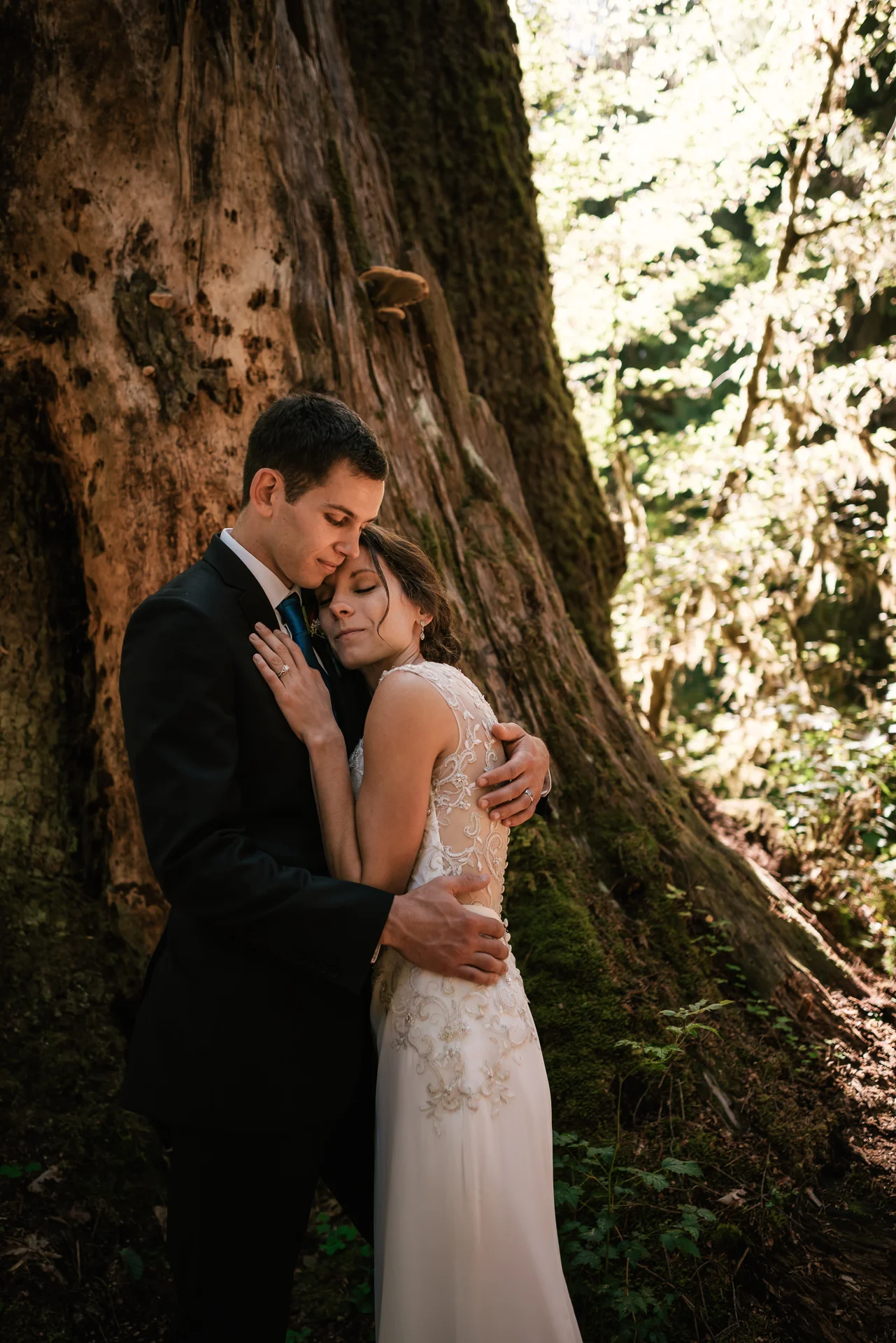 Newlyweds take a moment to enjoy their love after an intimate ceremony in Hoh Rainforest.