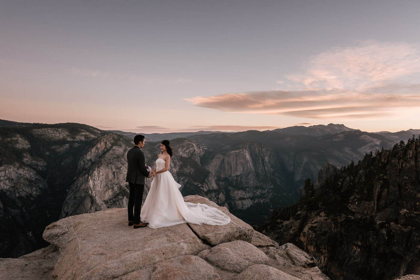 Bride and groom elope to Yosemite’s Taft point for a romantic sunrise ceremony.