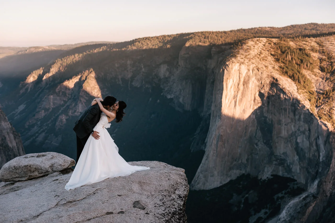 Groom dips his bride for a romantic portrait they'll never forget.