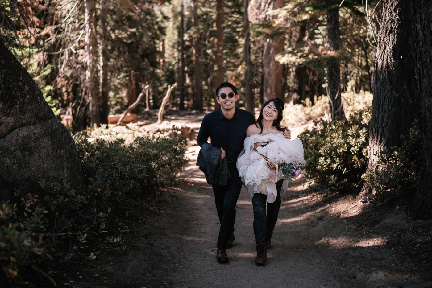 Couple hikes up to Sentinel Dome in their formal wedding attire.