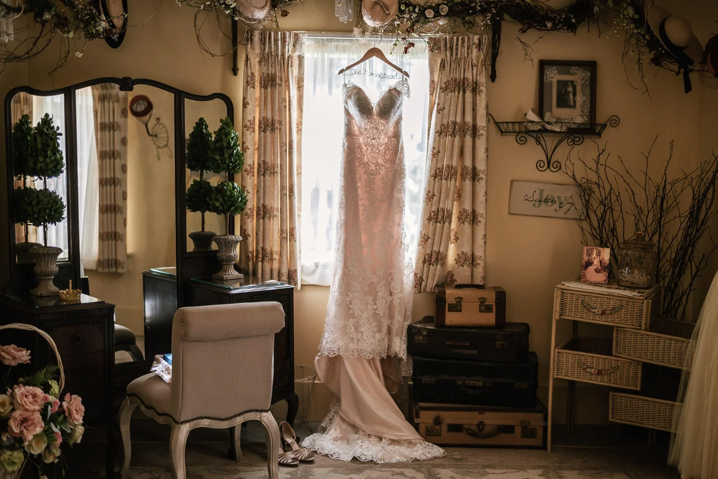 Gorgeous wedding dress hangs in the window of the bridal suite at The Homestead.
