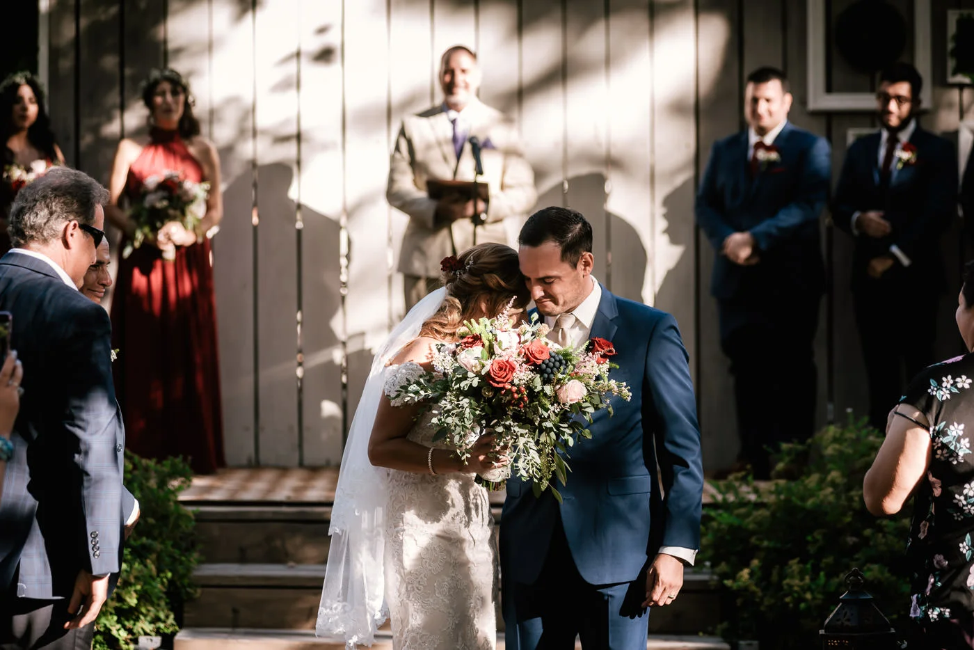 Couple takes a moment to get cloe and savor this sweet moment after pledging their lives together.