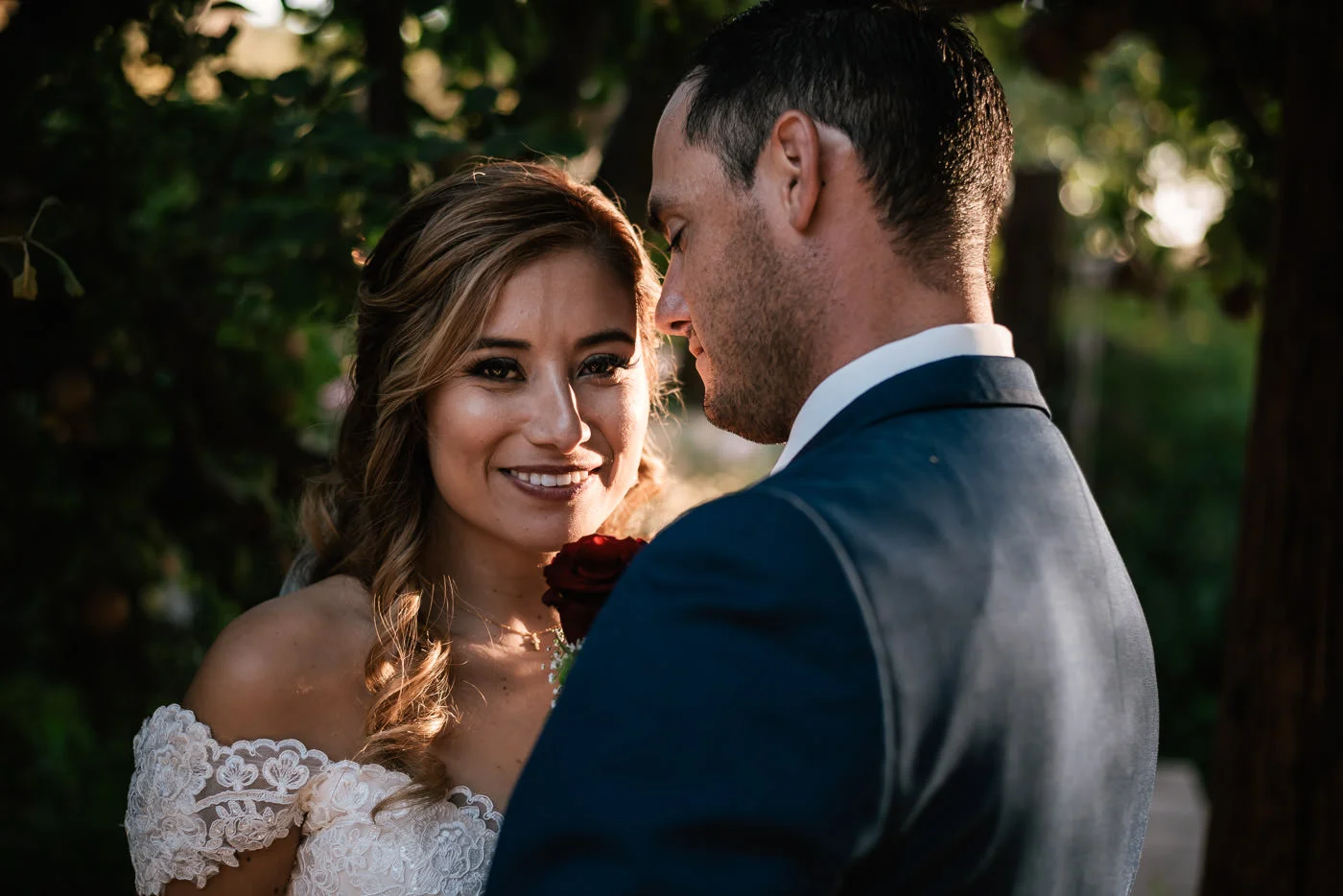 Newly married bride smiles with happiness after her rustic wedding at The Homestead at Wilshire Ranch.