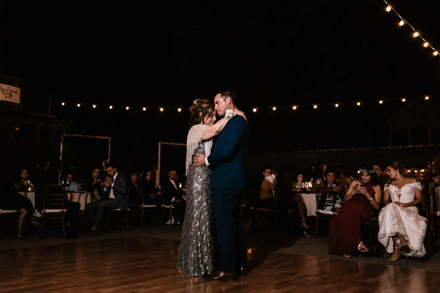 Mother and son have a lovely dance at the reception.