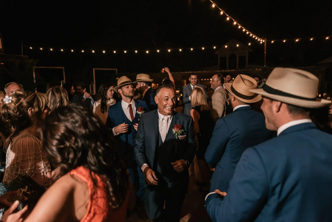 Father of the groom finds his son on the dance floor at The Homestead.