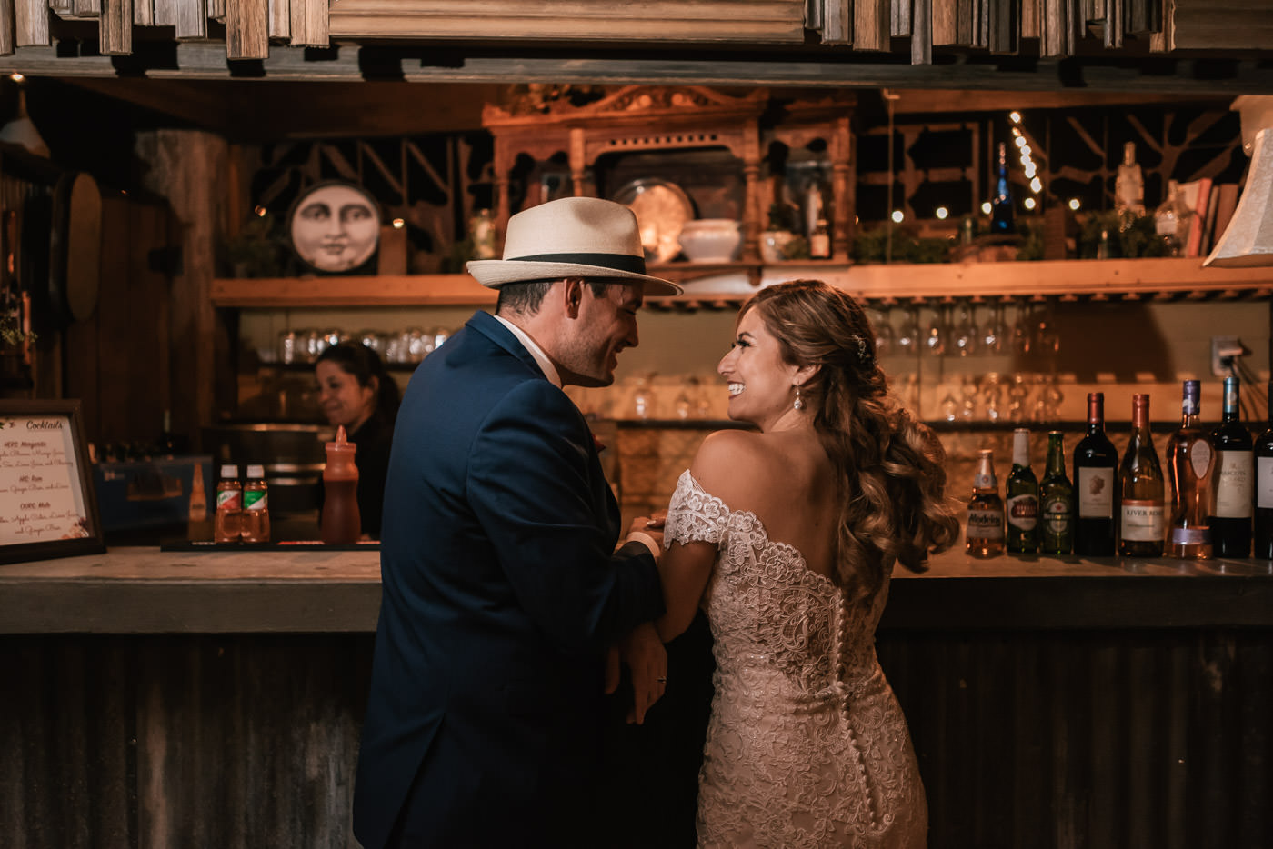 Newlyweds hit the bar and order their favorite drinks.