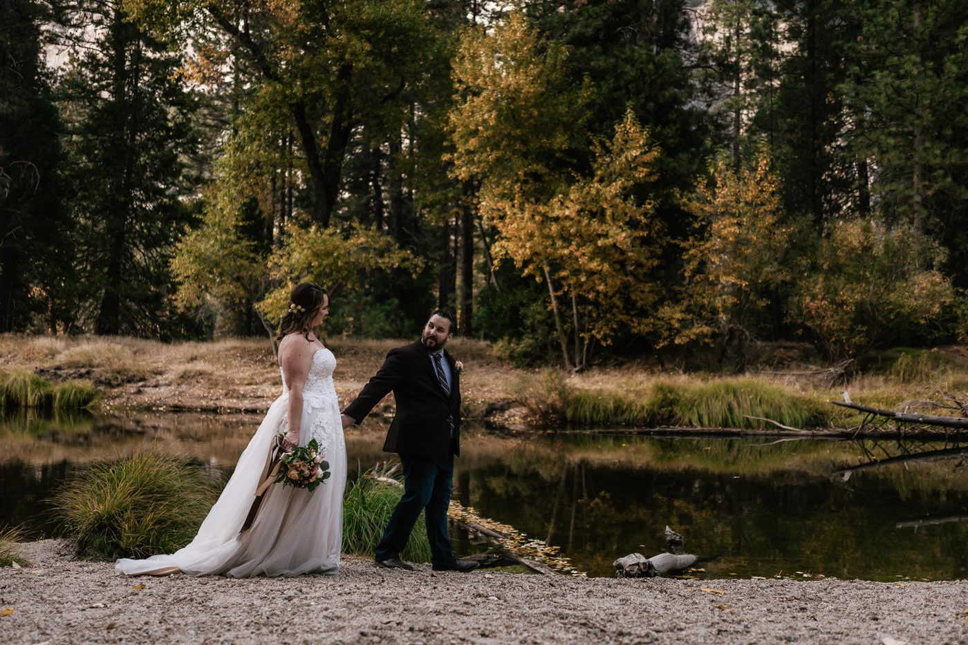 couple-walking-cathedral-beach-ceremony-locations-elope-yosemite-national-park.jpg