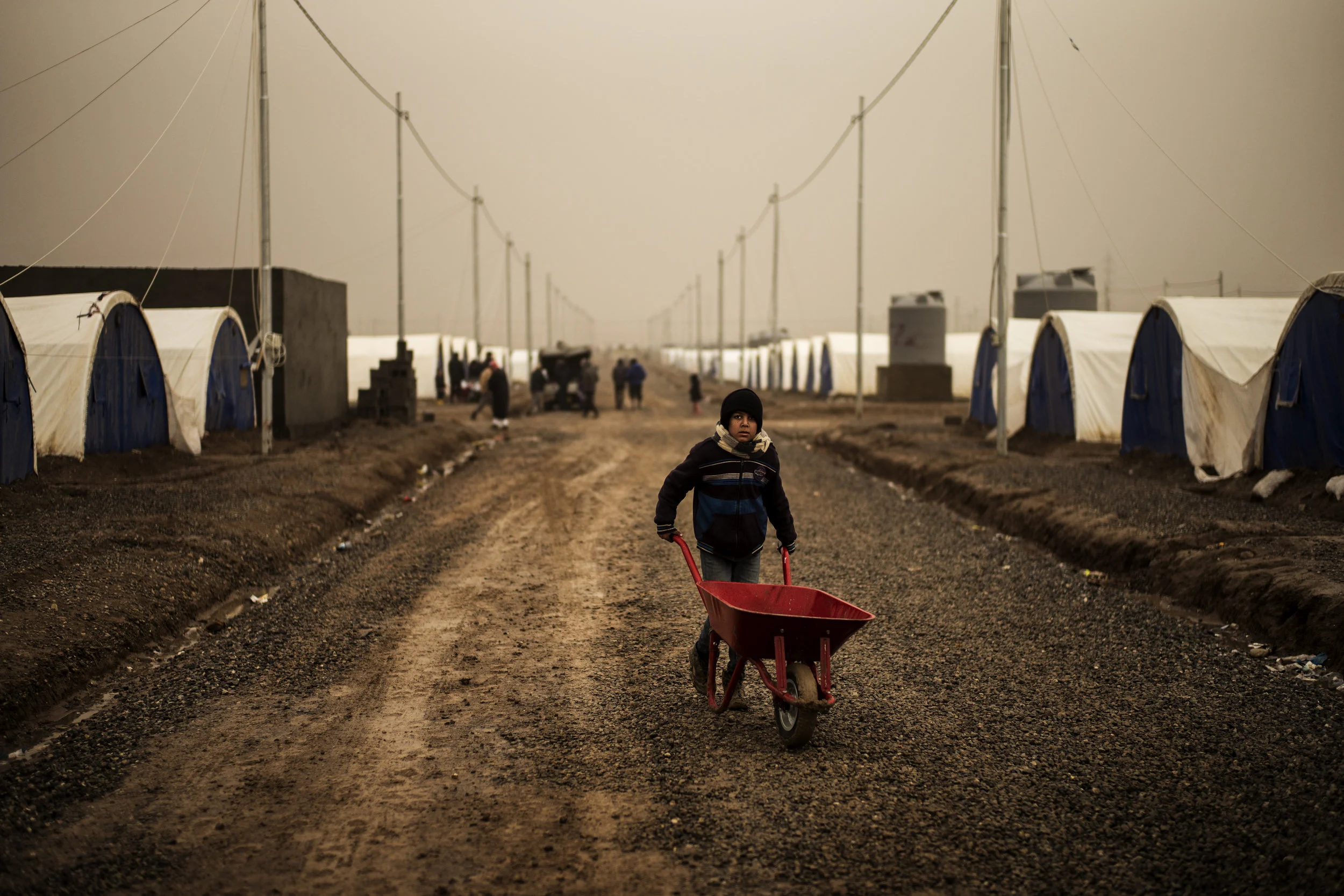 A boy going after water for his family at the Khazer IDP-camp near Mosul.