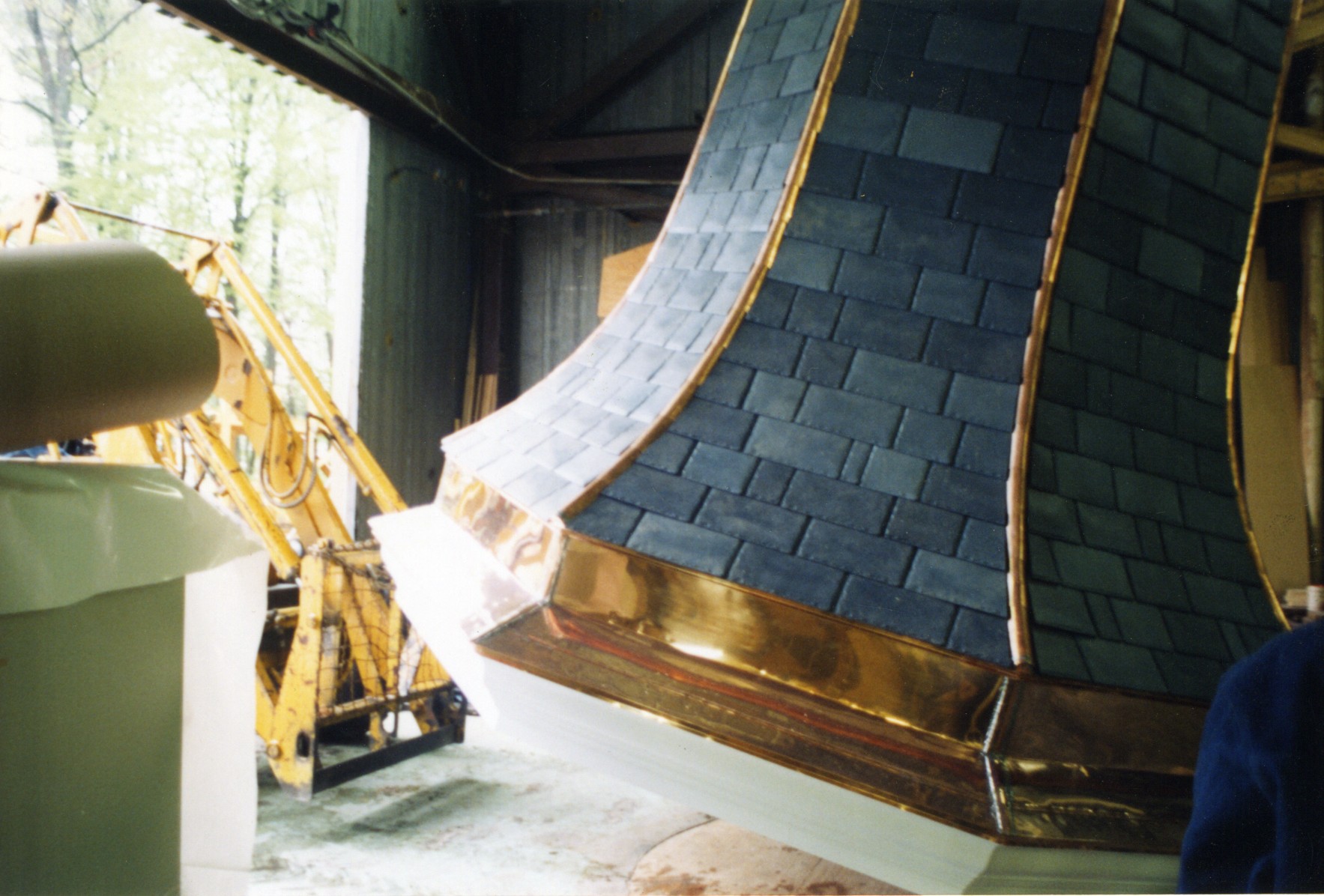 Bottom detail showing flashing and slate shingles of spire