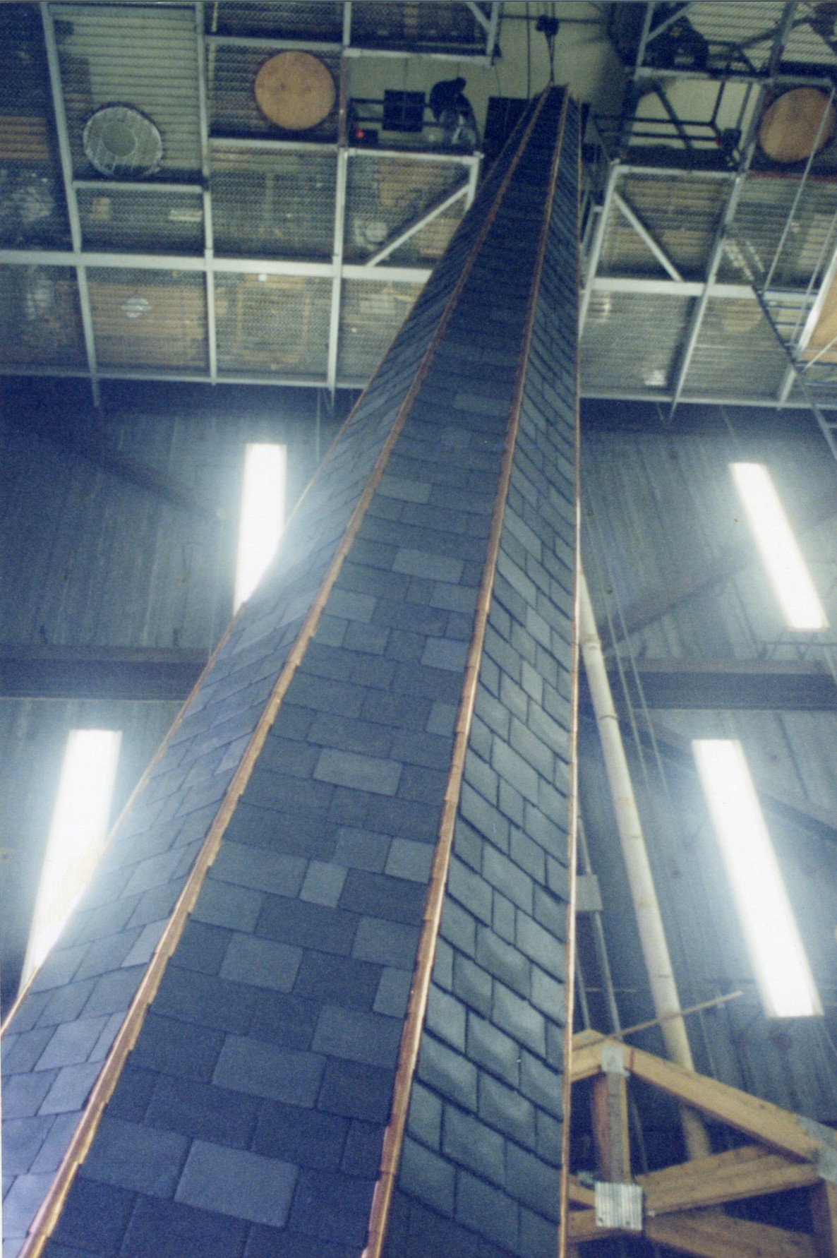 Detail showing flashing and slate shingles on spire