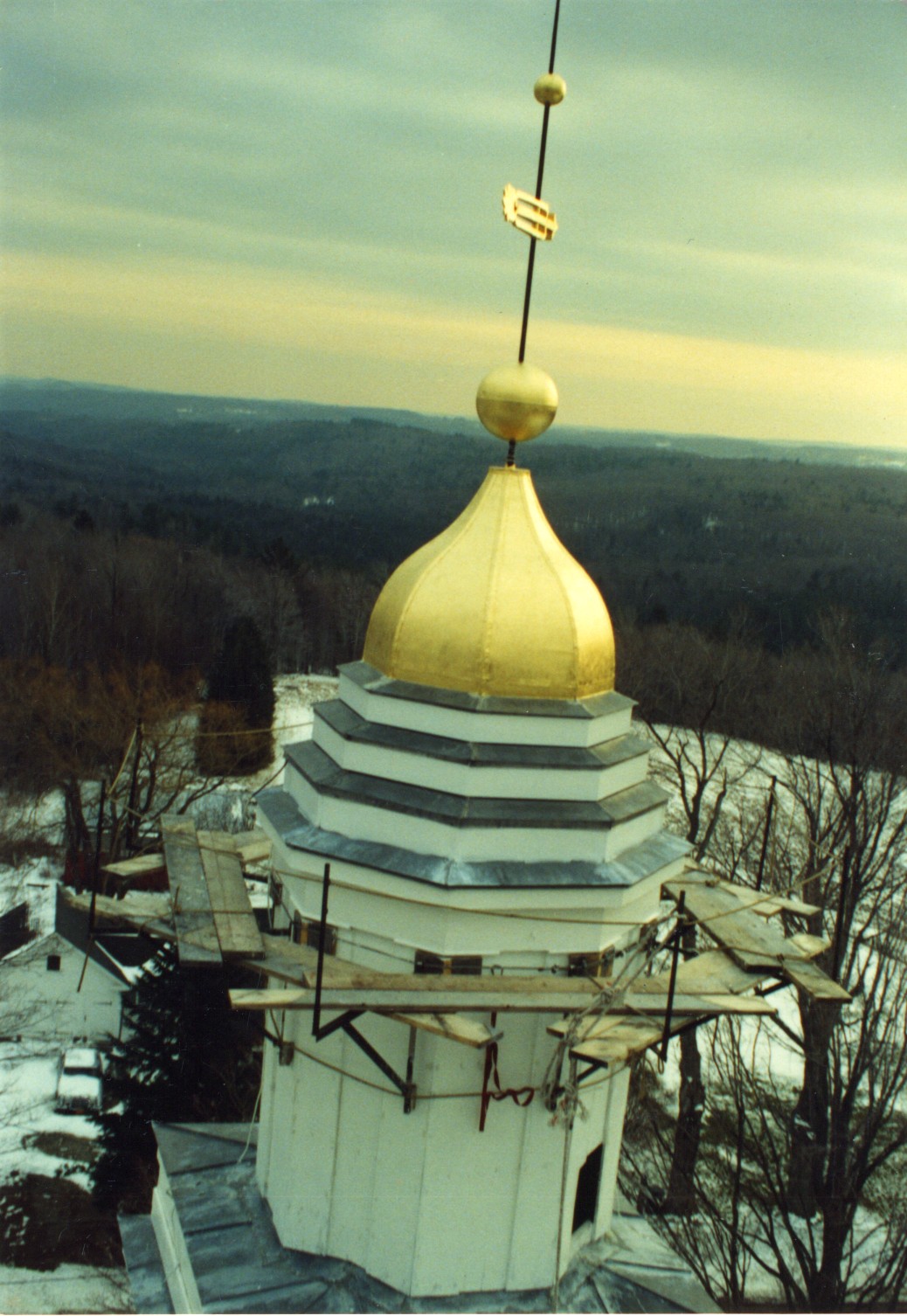 Two stacked cupolas with an eight sided dome atop