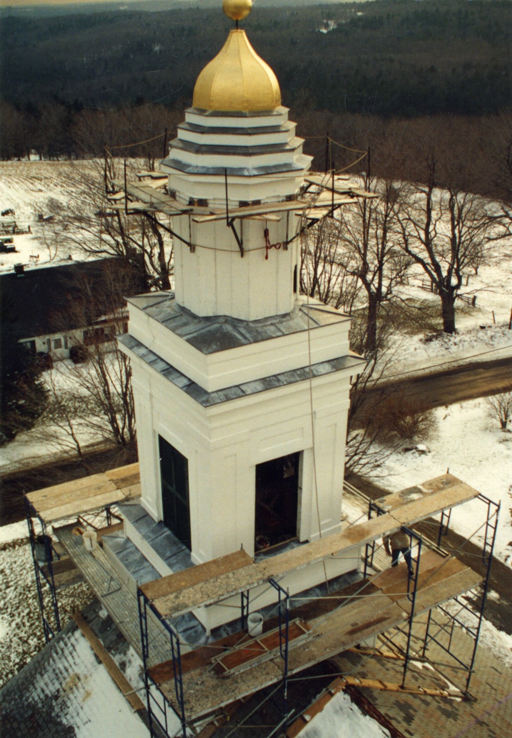 Two stacked cupolas with an eight sided dome atop