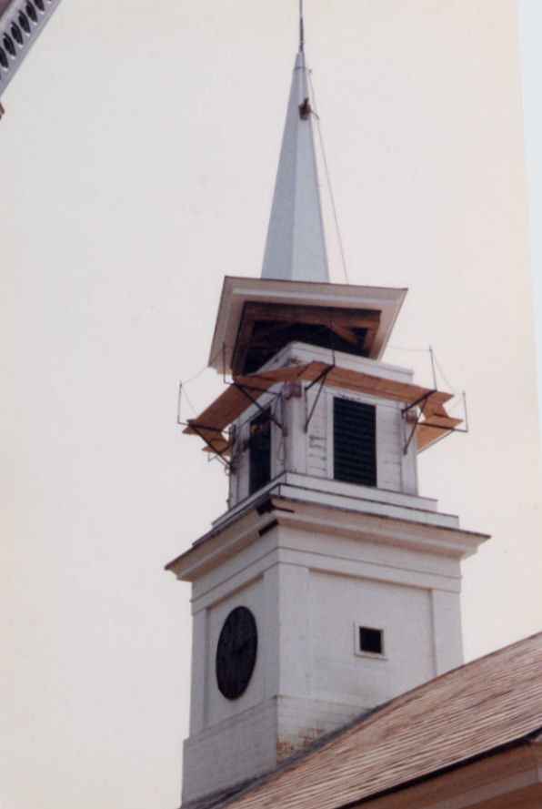 A two cupola steeple with a tall spire