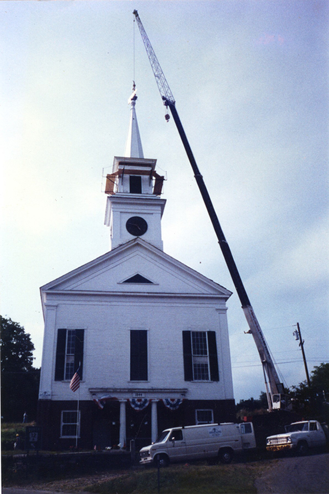 A two cupola steeple and a tall spire