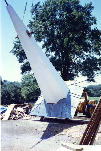 A two cupola steeple and a tall spire