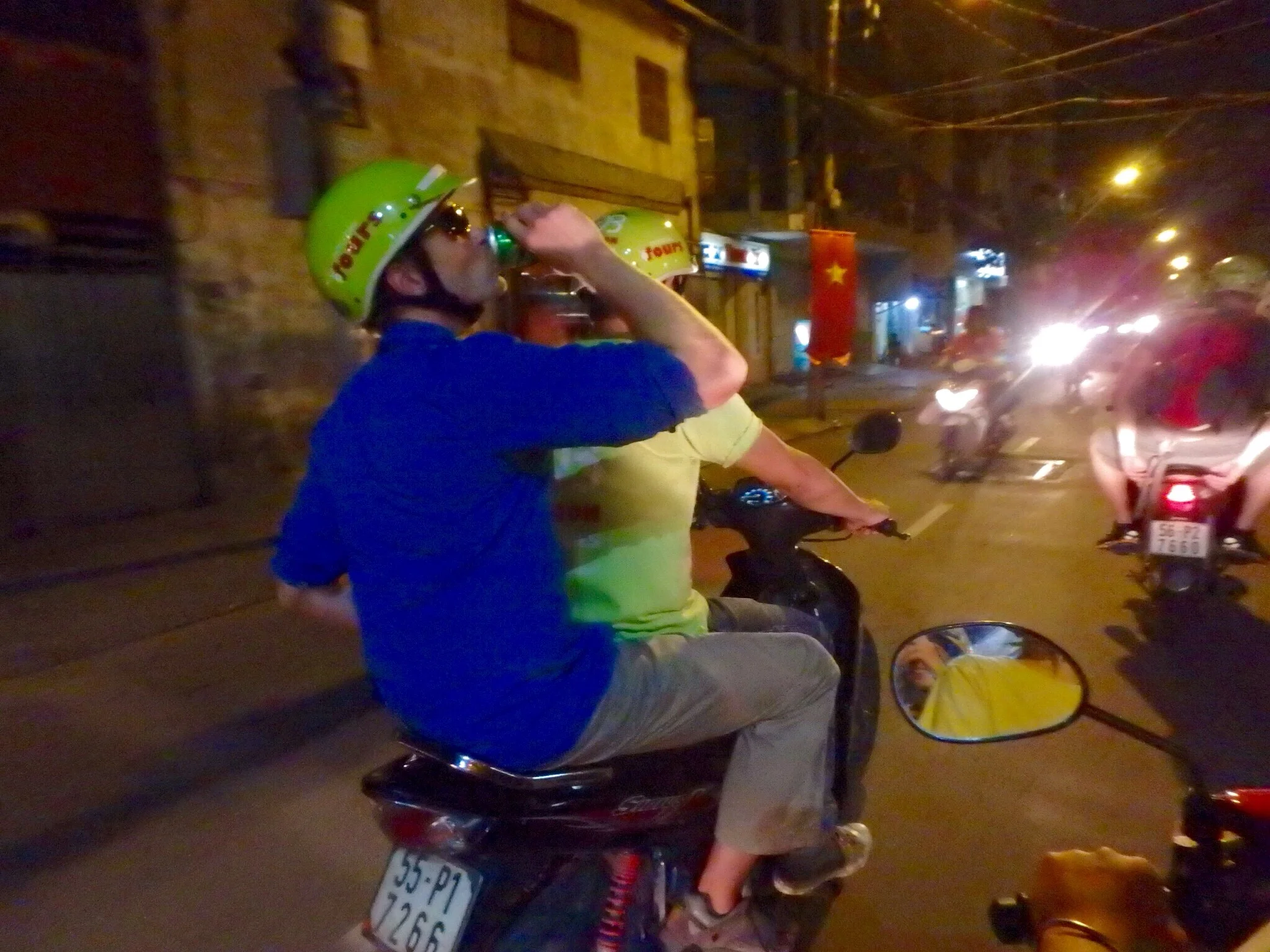 Jonathan enjoys a very light beer on the back of the motorbike, which is legal in Vietnam. Don't worry, drivers aren't afforded the same luxury.