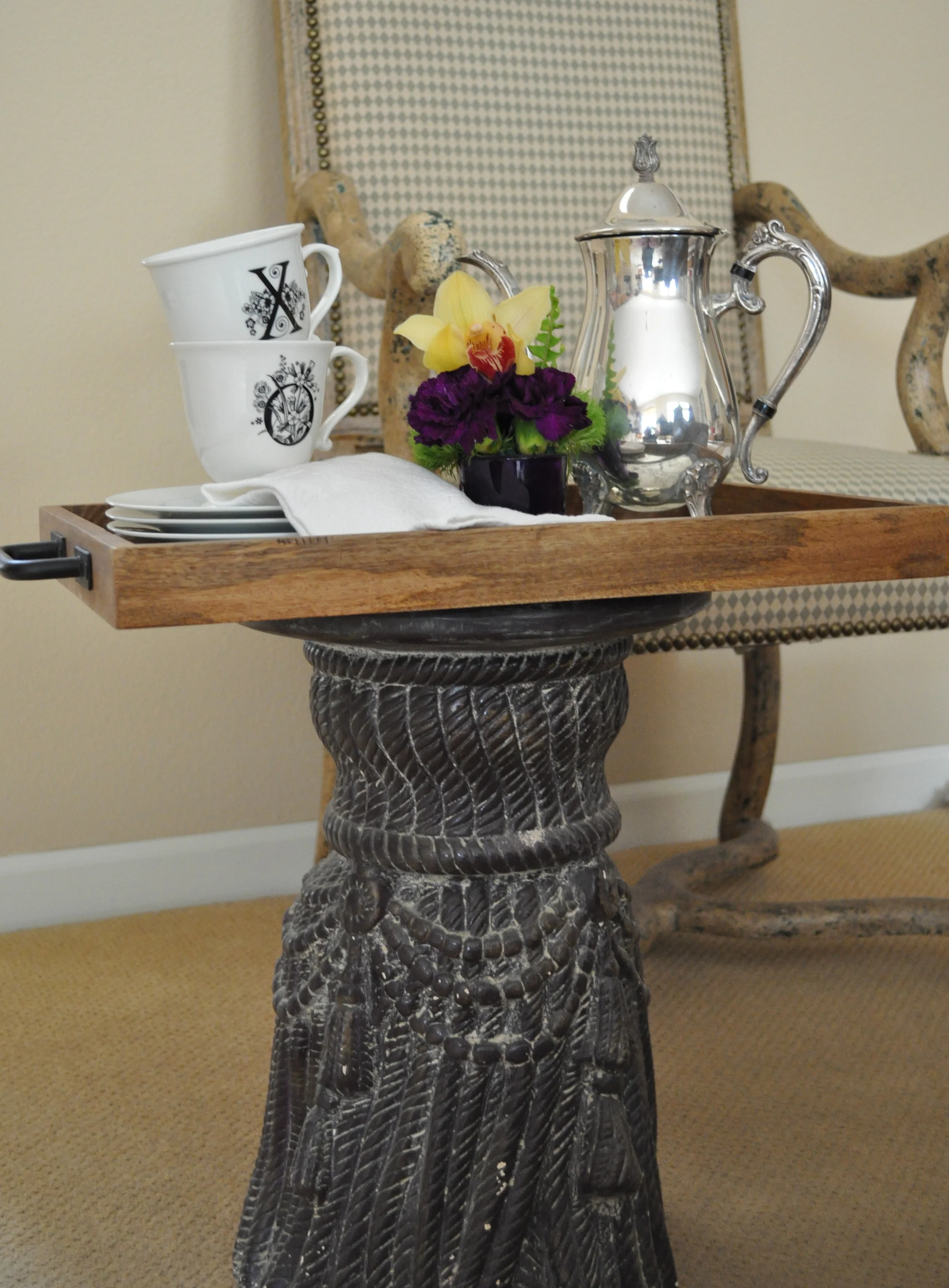 Even a little plant stand and tray will work.