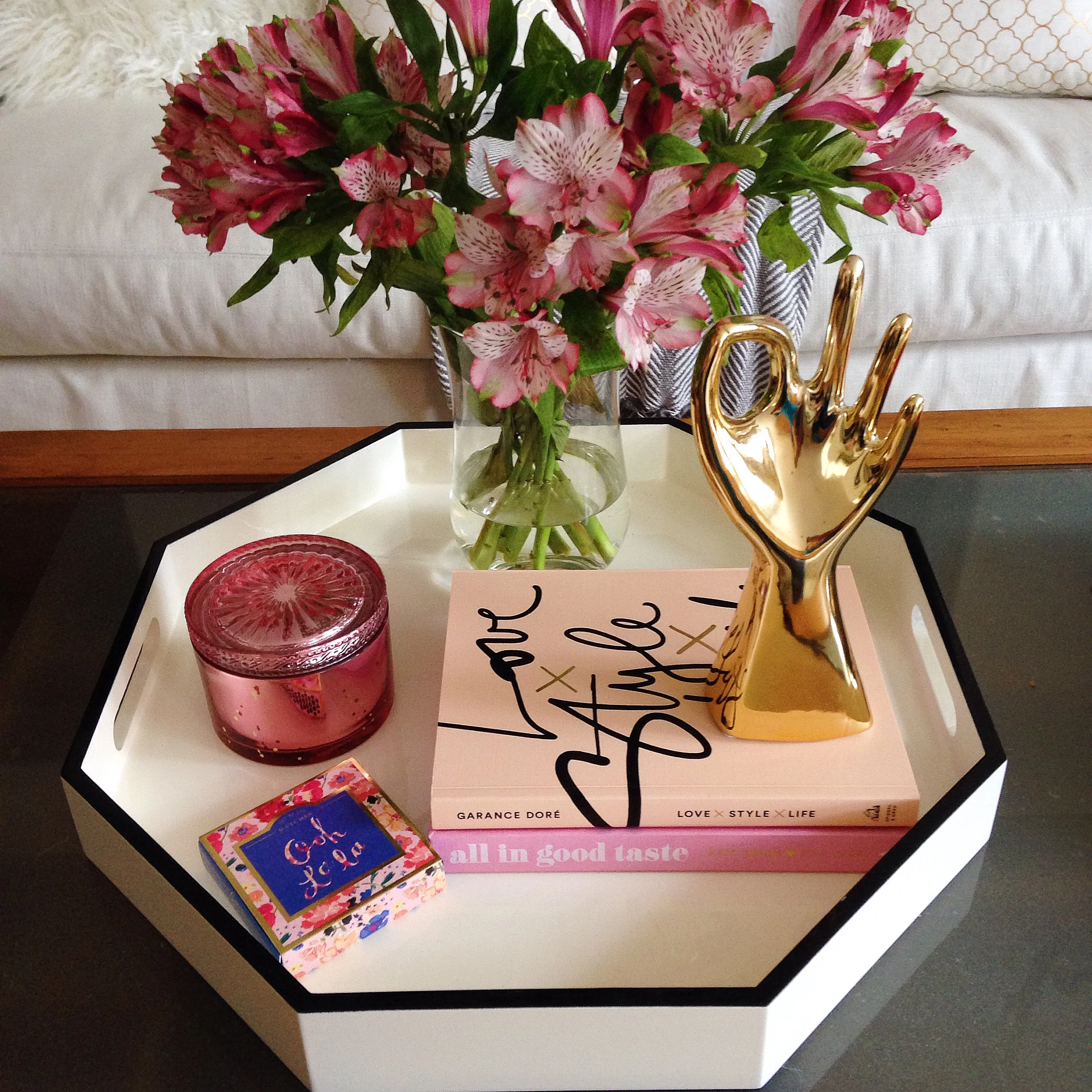 Another great way to add color is by grouping colorful decor items in trays.
