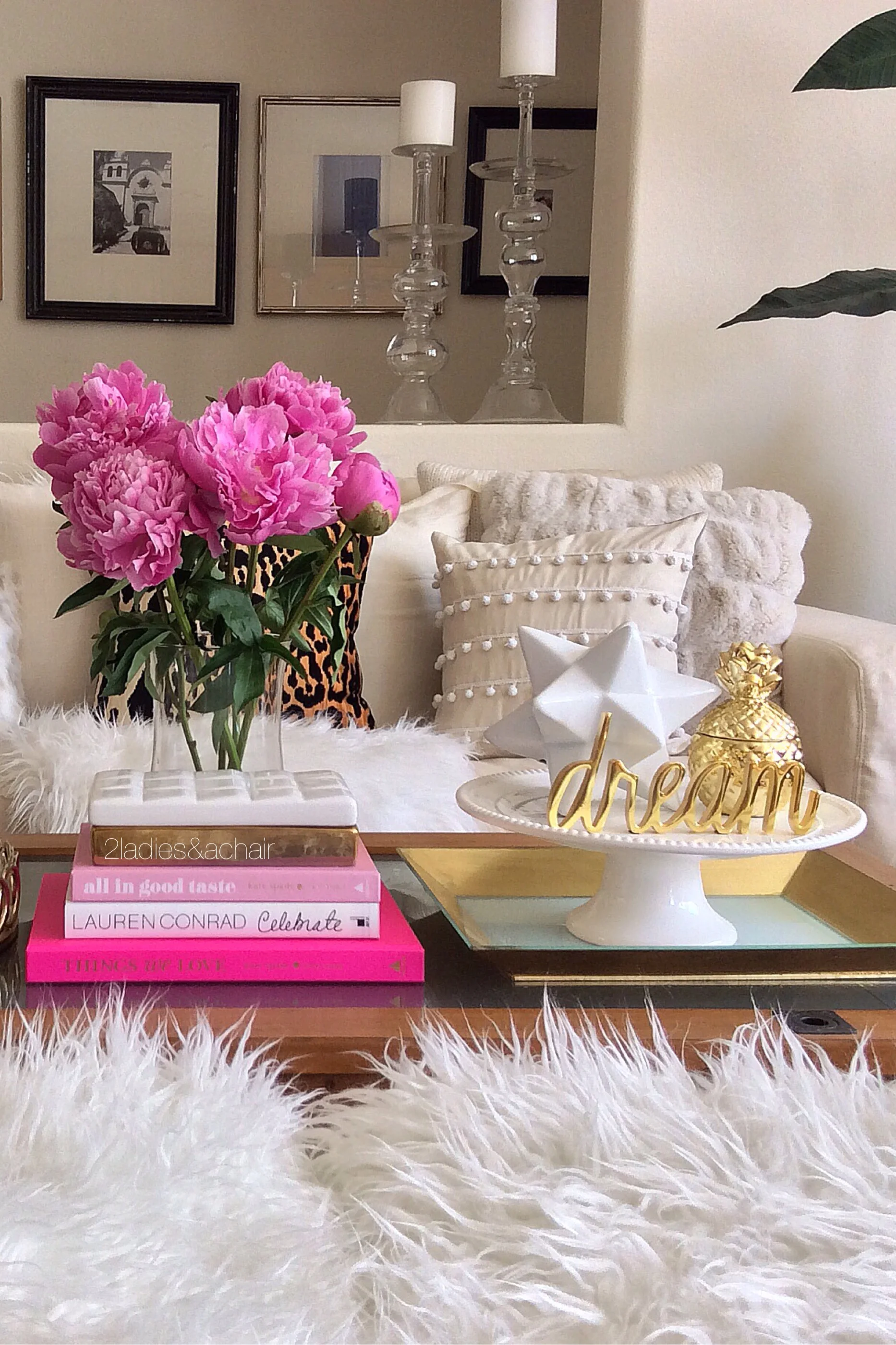 I collect cookbooks and design/style books. They are always stacked around my house in various places. In this photo they are my pink accent color! Below, cocktail books are stacked for easy access and inspiration by the bar cart.