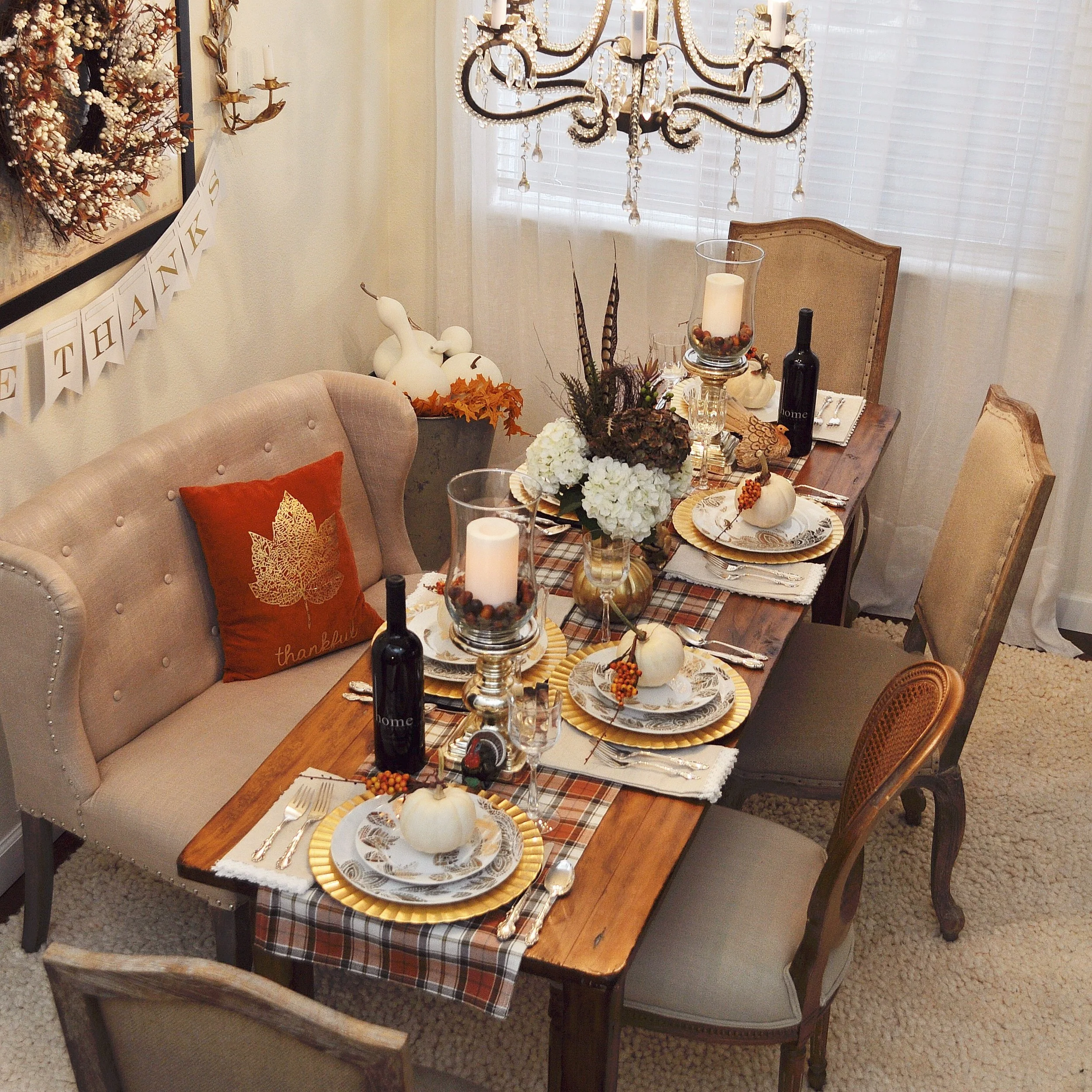 I love Thanksgiving on this rustic farmhouse table. I added this traditionally fall plaid table runner I found at HomeGoods.