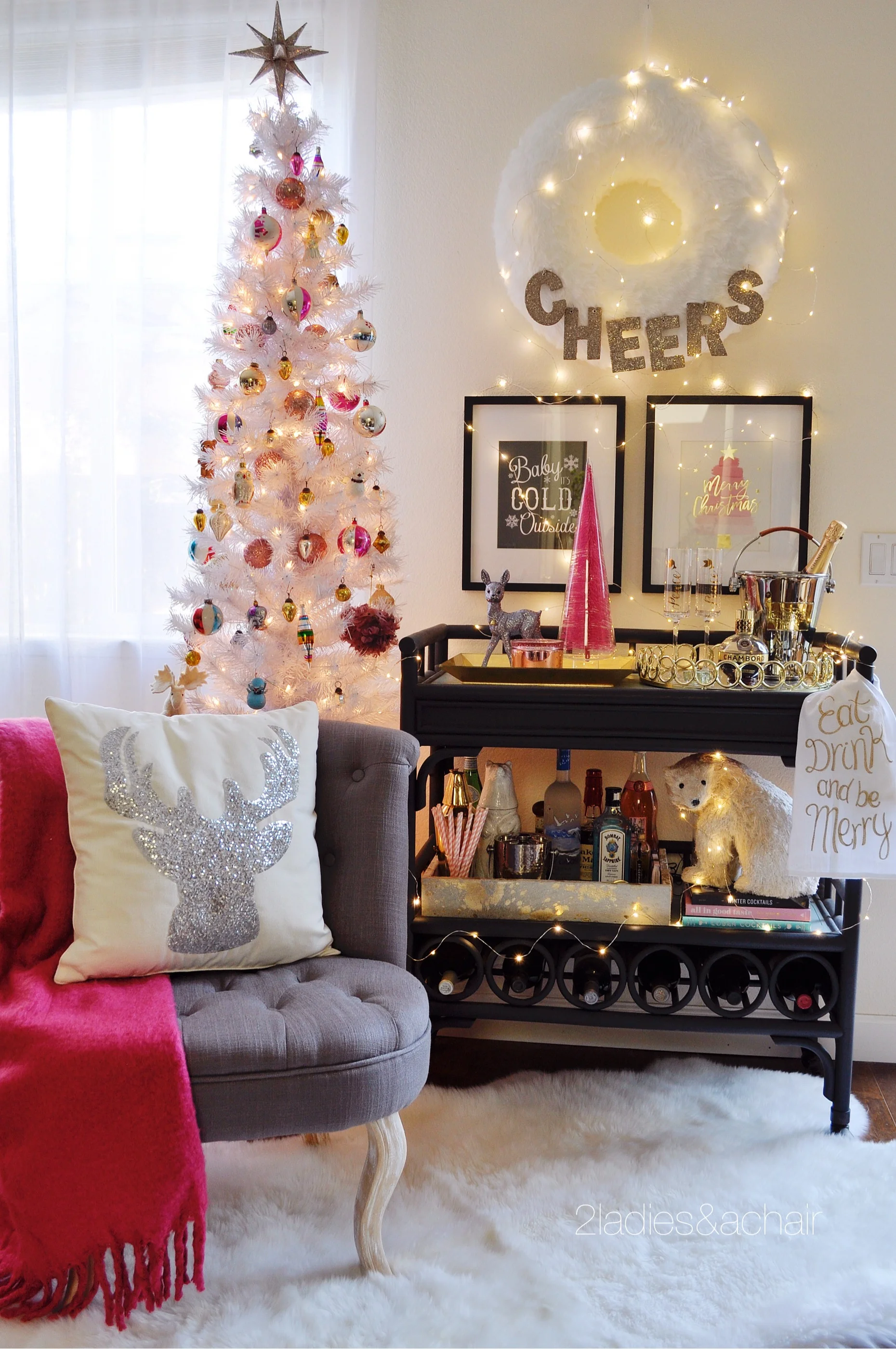 White furry wreath, sparkle deer pillow, pink tree, and retro-glitter deer all found at HomeGoods! The framed pink tree was a gift bag that I cut up to make my own personal print!