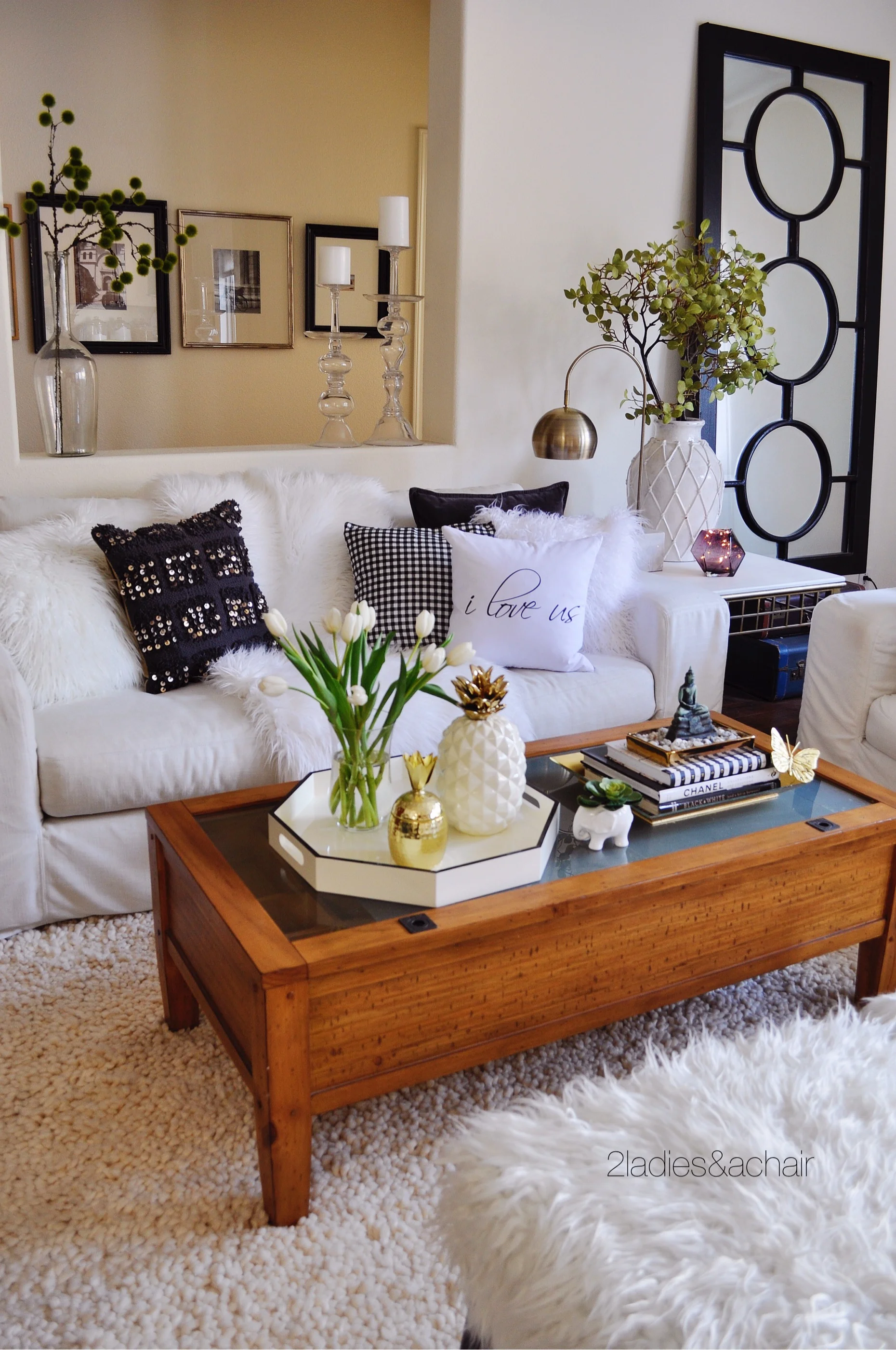 I was thinking maybe a grey weathered wood round coffee table? Hmmm....