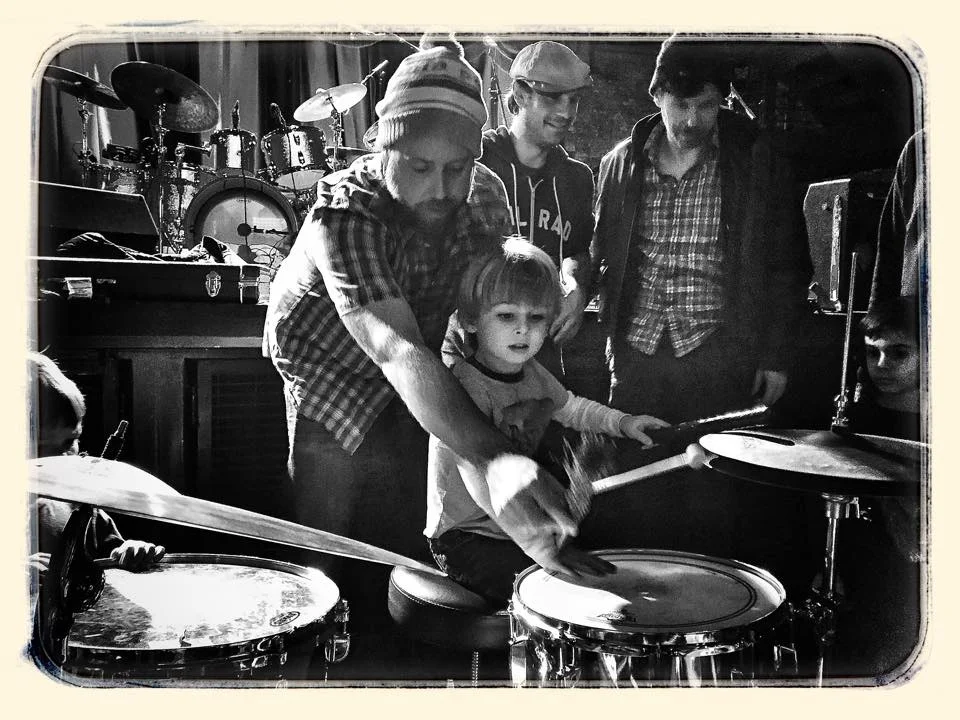 Joe Russo showing a little drummer how it's done. Photo by Josh Baron