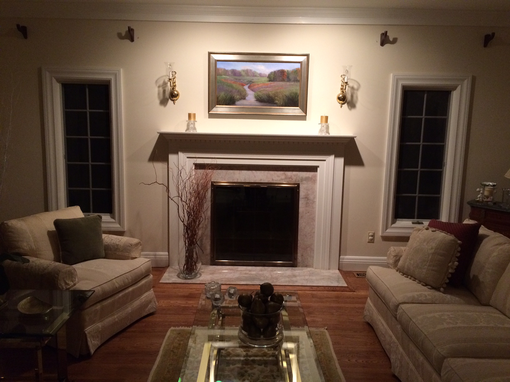 The painting above the hearth in this lovely home is a commissioned work in soft pastel by Sherry Rhyno. The gallery collectors were inspired by a marsh study in pastel they saw in the gallery by Sherry — a 6" x 8" piece done on location -- and asked Sherry to paint that "scene and feel" in a painting sized to suit their home at 18" high by 34" wide.