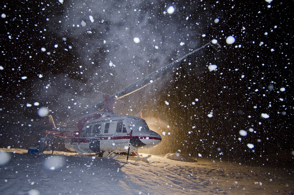 Heli-ski helicopter in heavy snowfall