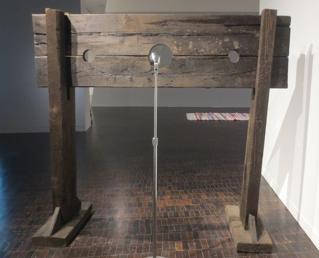 "What Goes Without Saying" (2012), by Hank Willis Thomas. Wooden pillory and microphone.