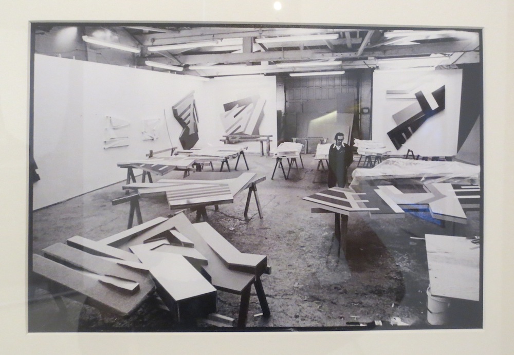 Frank Stella at his West Houston studio with works from the Polish Village series, 1974. Original photo by Nancy Crampton.