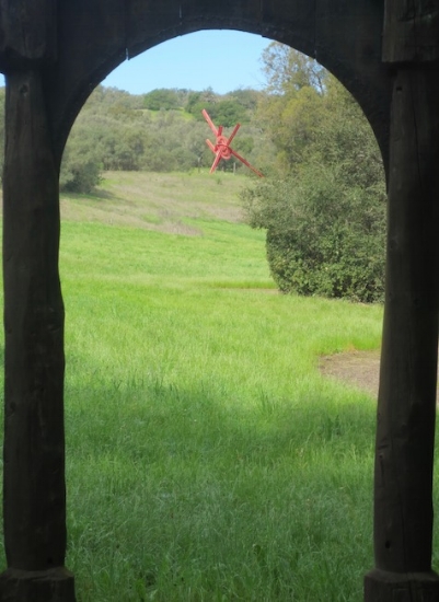 Looking through arch of one sculpture toward For Veronica (1987), by Mark di Suvero. Steel, paint. Created for Veronica di Rosa.