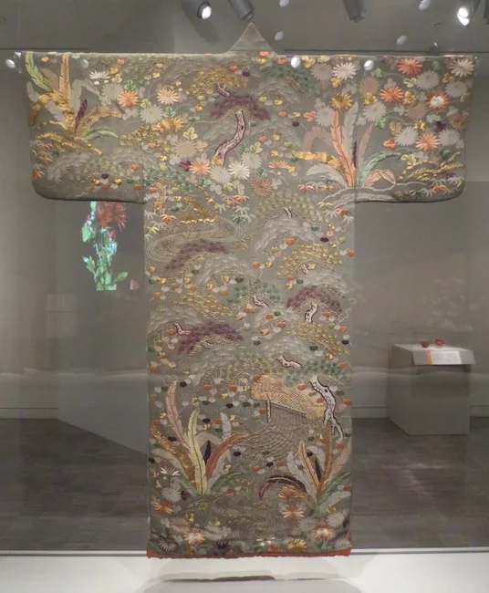 Robe ( kosode ) with landscape and literary designs ( goshodoki ), approx. 1800-1850. Japan. Silk crepe ( chirimen ) with embroidery. Asian Art Museum, San Francisco.