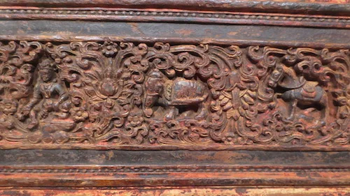 Wooden scripture cover (c. 15th c., Tibet). Wood and mineral pigments.