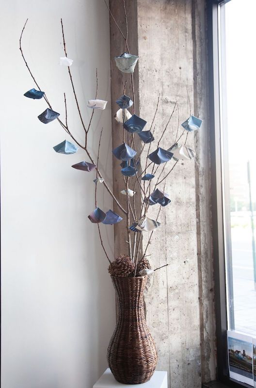Indigo Tree, II 68”H painted silk organza; indigo hand-dyed silk, cotton, linen; design samples; stitched by hand; copper wire; tree limbs, pine cones; wicker basket