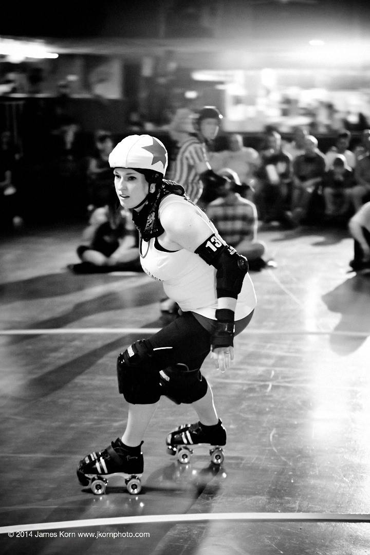 SJ jams against South Bend Roller Girls' Bonnie Dooms, April 14, 2014. Photo by JKorn Photographics