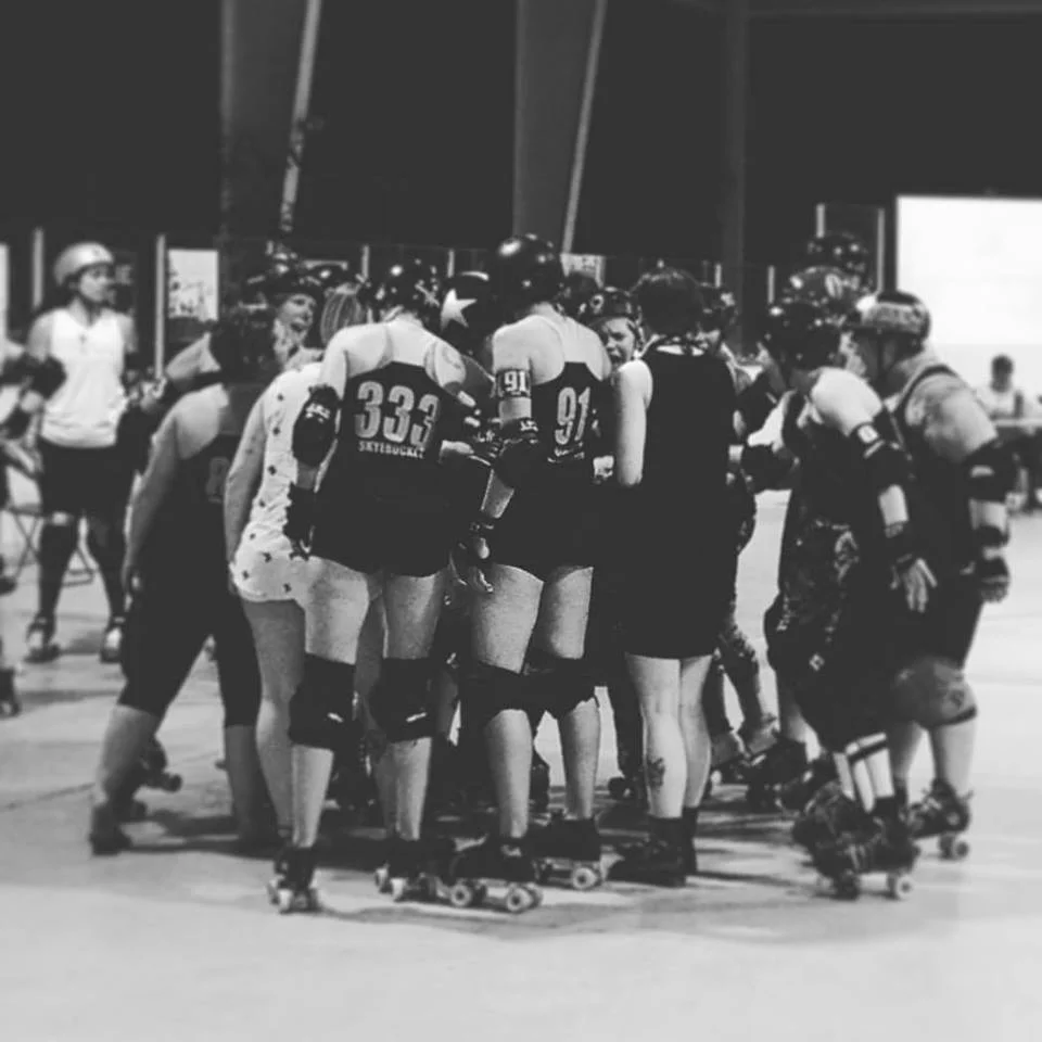 Ypsilanti Vigilantes huddle up during their last home game of 2016, August 6 at Buhr Park. Photo by Bear-a-Cuda.