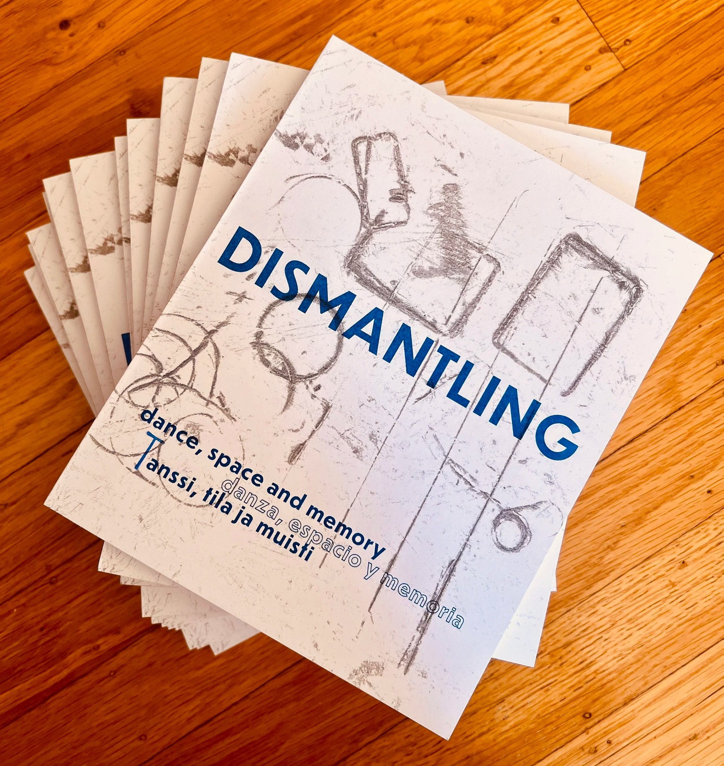 Stack of Dismantling books "DISMANTLING. dance, space and memory. danza, espacio y memoria, tanssi, tila ja muisti"