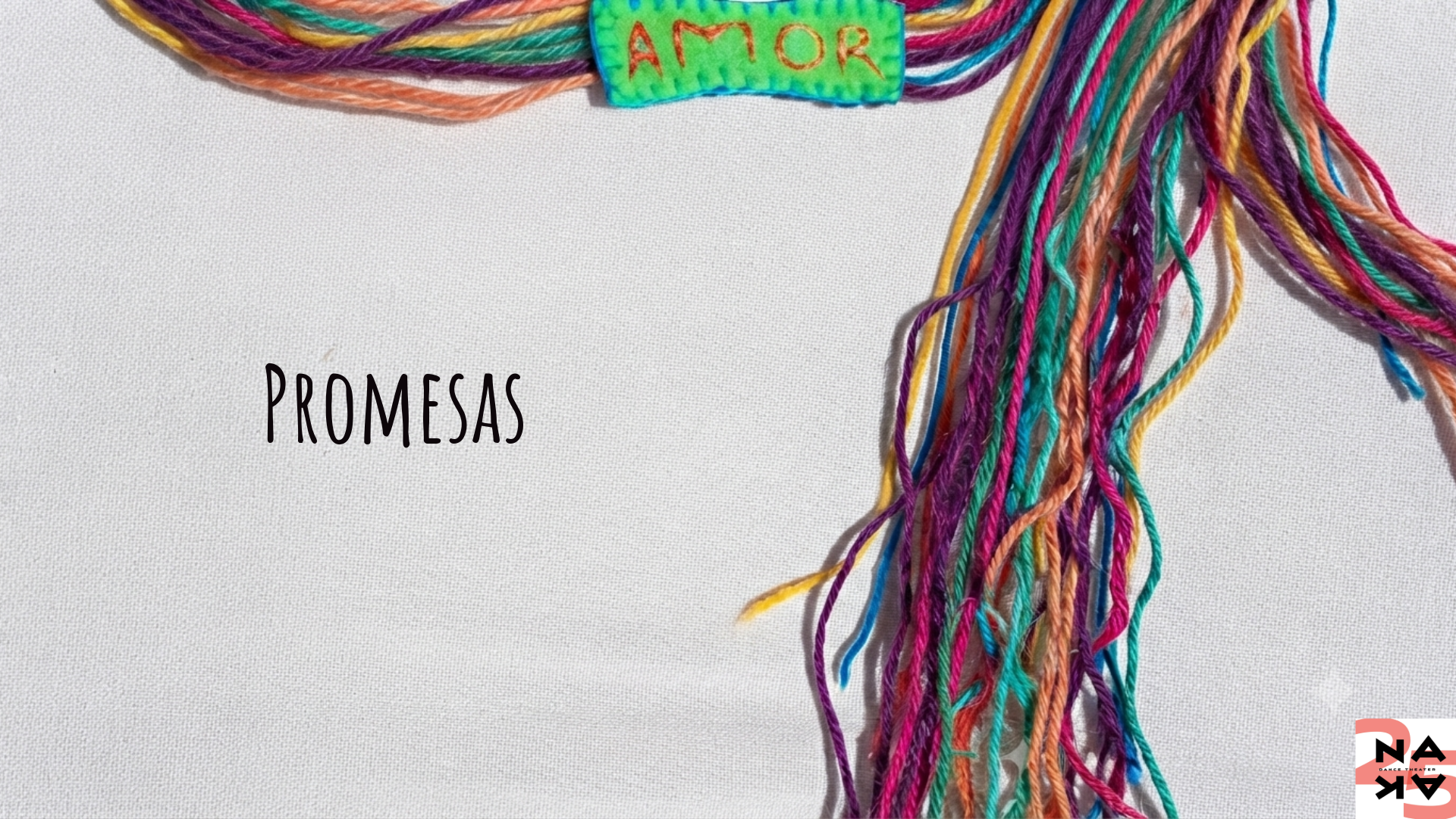 "Promesas" Colorful thread on a white background.