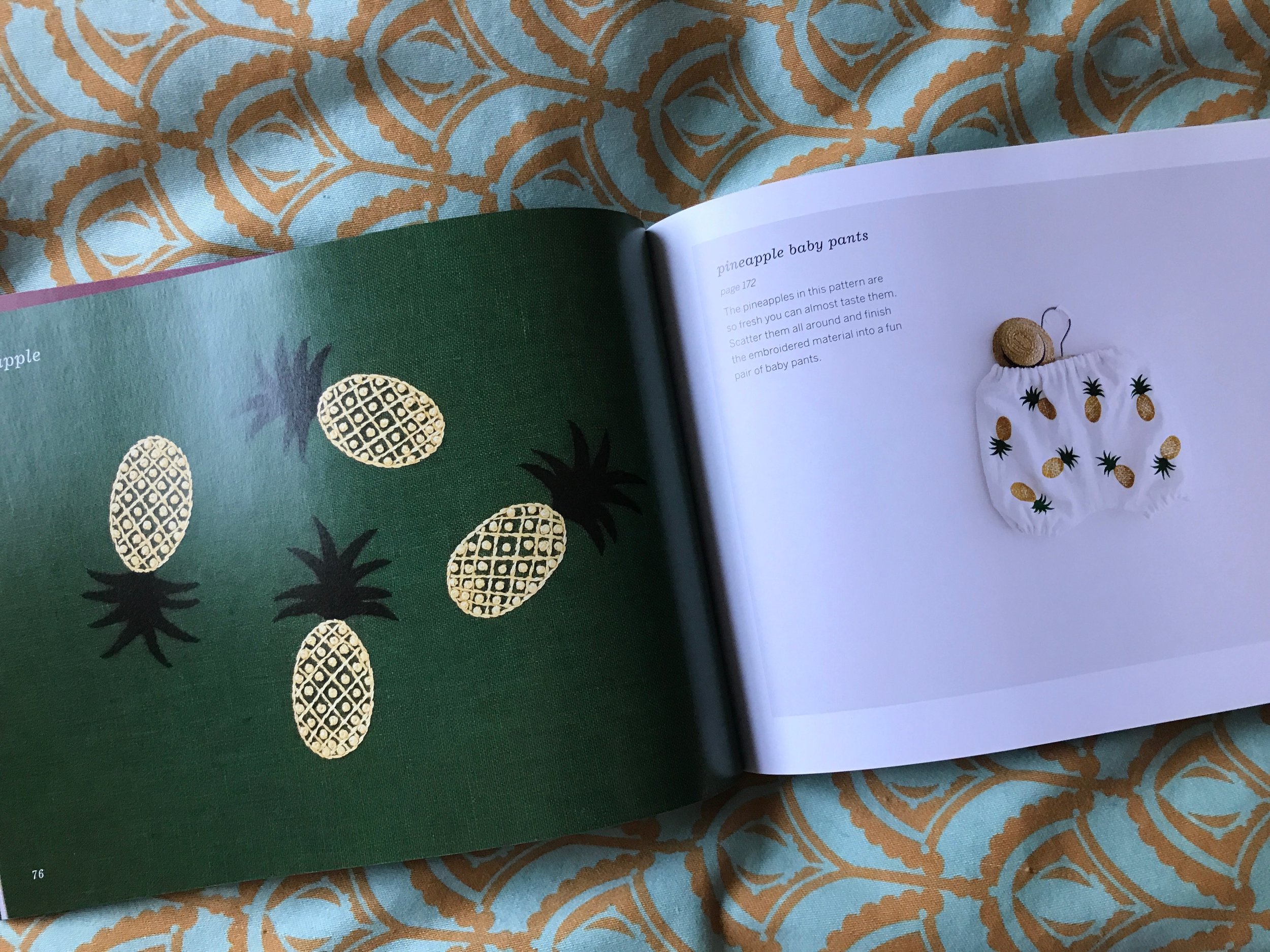 Have you been seeing pineapples everywhere in home decor lately? The pineapple has long been seen as a traditional expression of "welcome" in a home! A single pineapple in a small hoop would have big impact for a friend or entryway. Eight pineapples on a pair of baby bloomers is pretty sweet welcome to the world!
