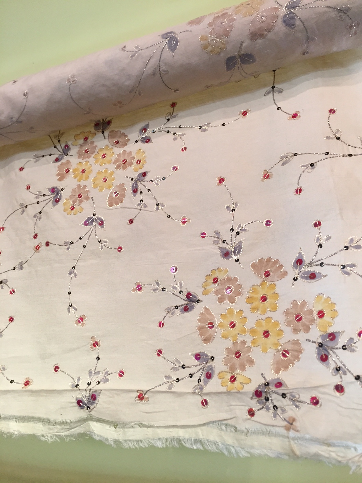 Painted and sequin-ed silk. Oooh, la, la.