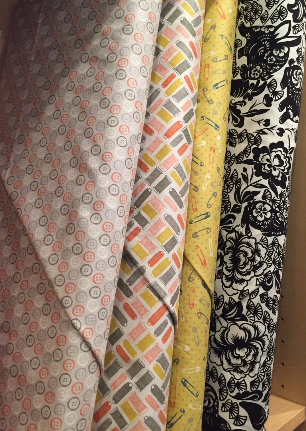 Sweet sewing notion themed prints and a bold papercut style black/cream with rather ornate rabbits...