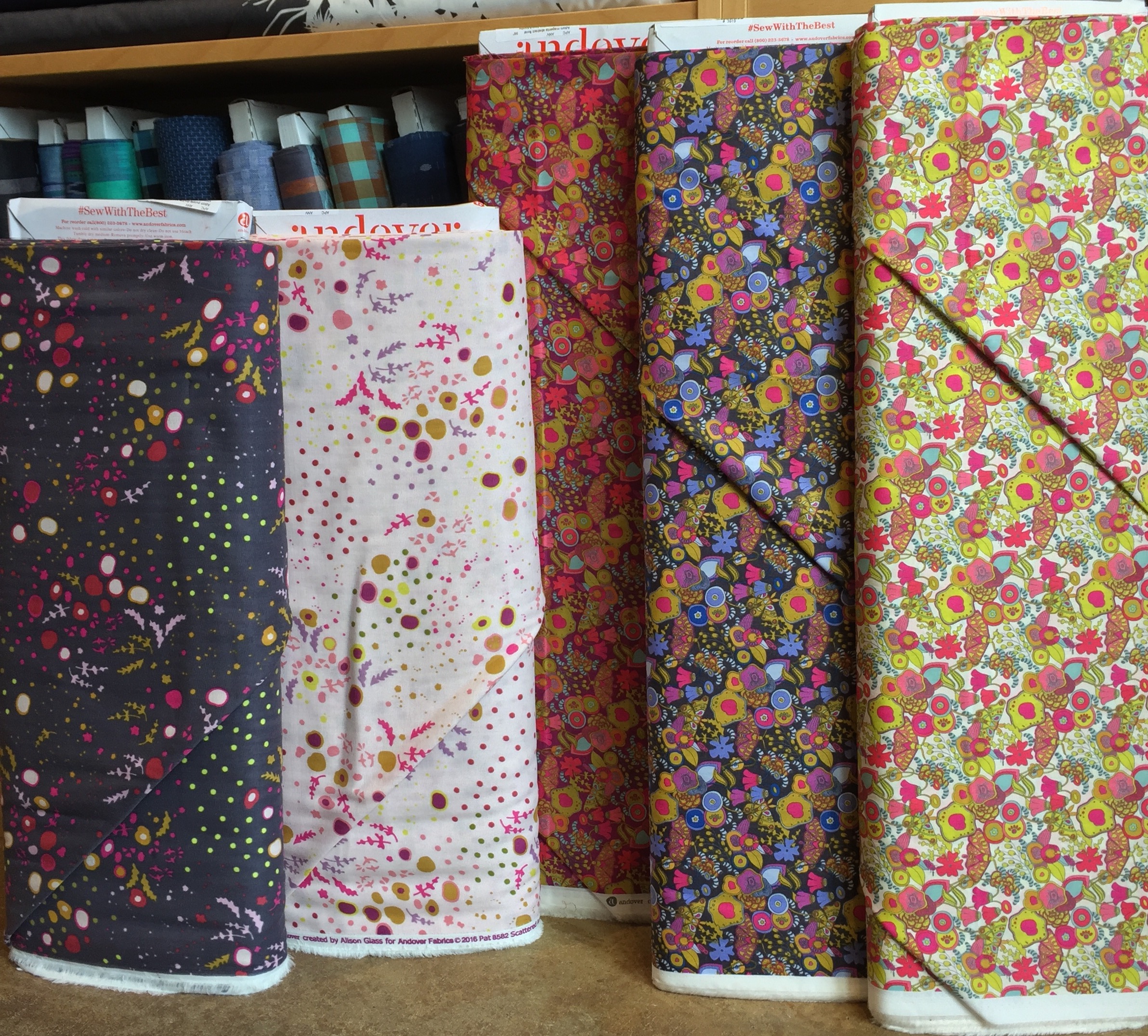 A pair of lively floral double gauze prints on the left and three bright floral cotton lawns on the right.