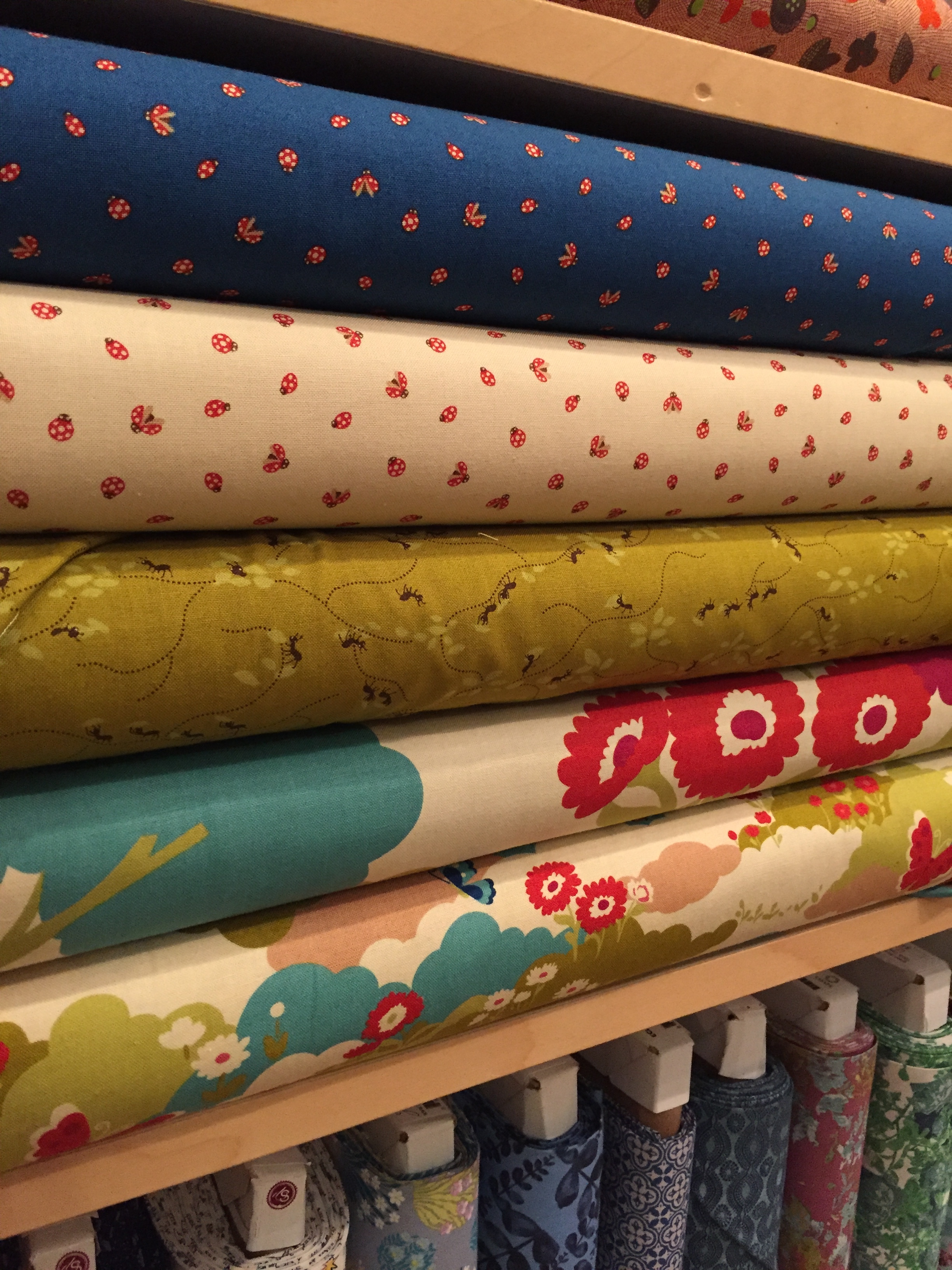 Ants, ladybugs and butterflies in this charming group by Momo for Moda.