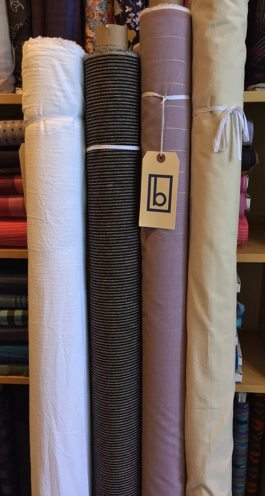 (L to R): light weight cotton subtle stripe, linen blend dark stripe, cotton stripe with metallic accent, cotton slub solid