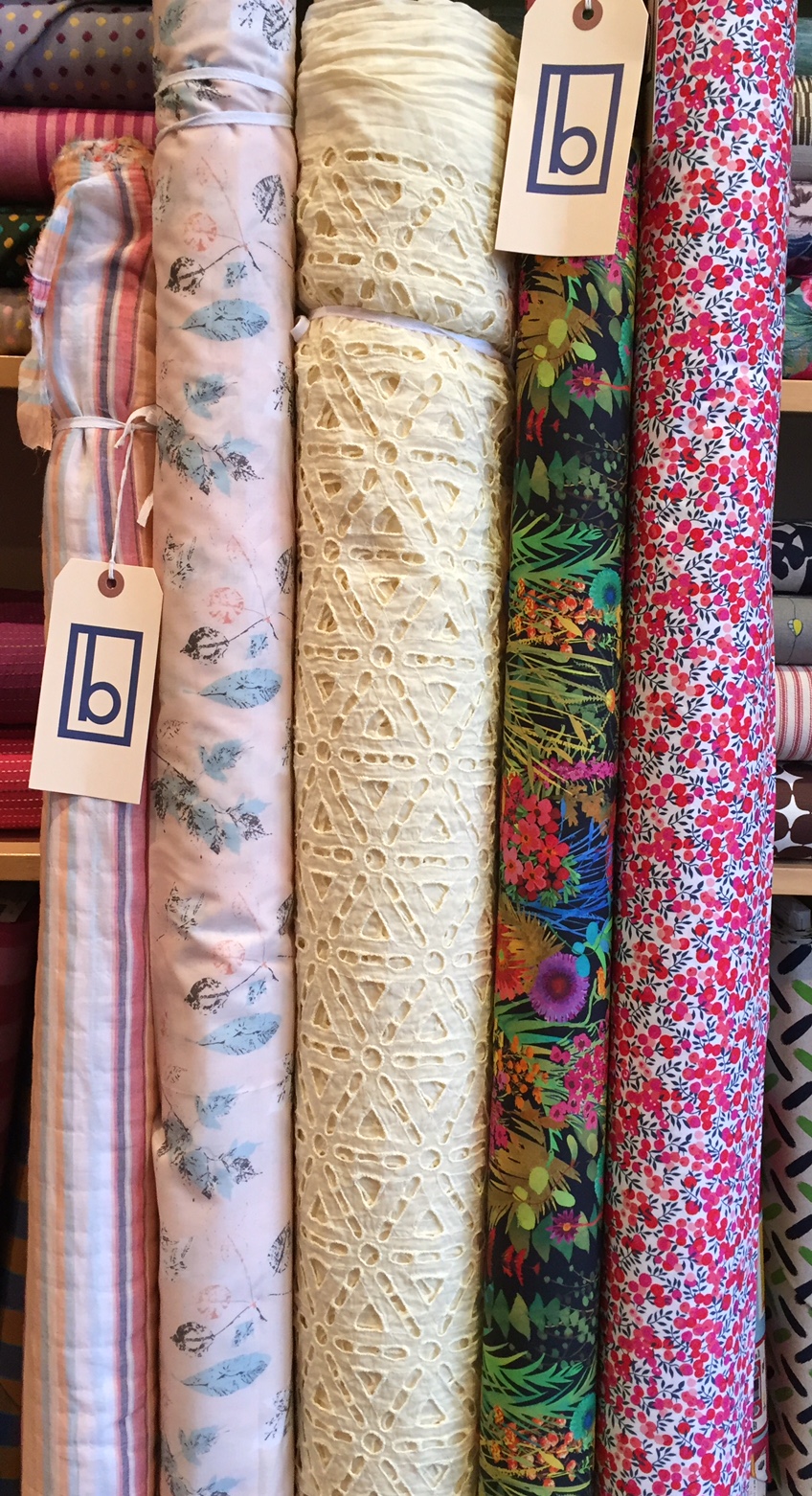 A variety of cottons, from super light weight stripe and softly colored cotton lawn on the far left, to a stretch cotton poplin from Liberty of London on the far right.
