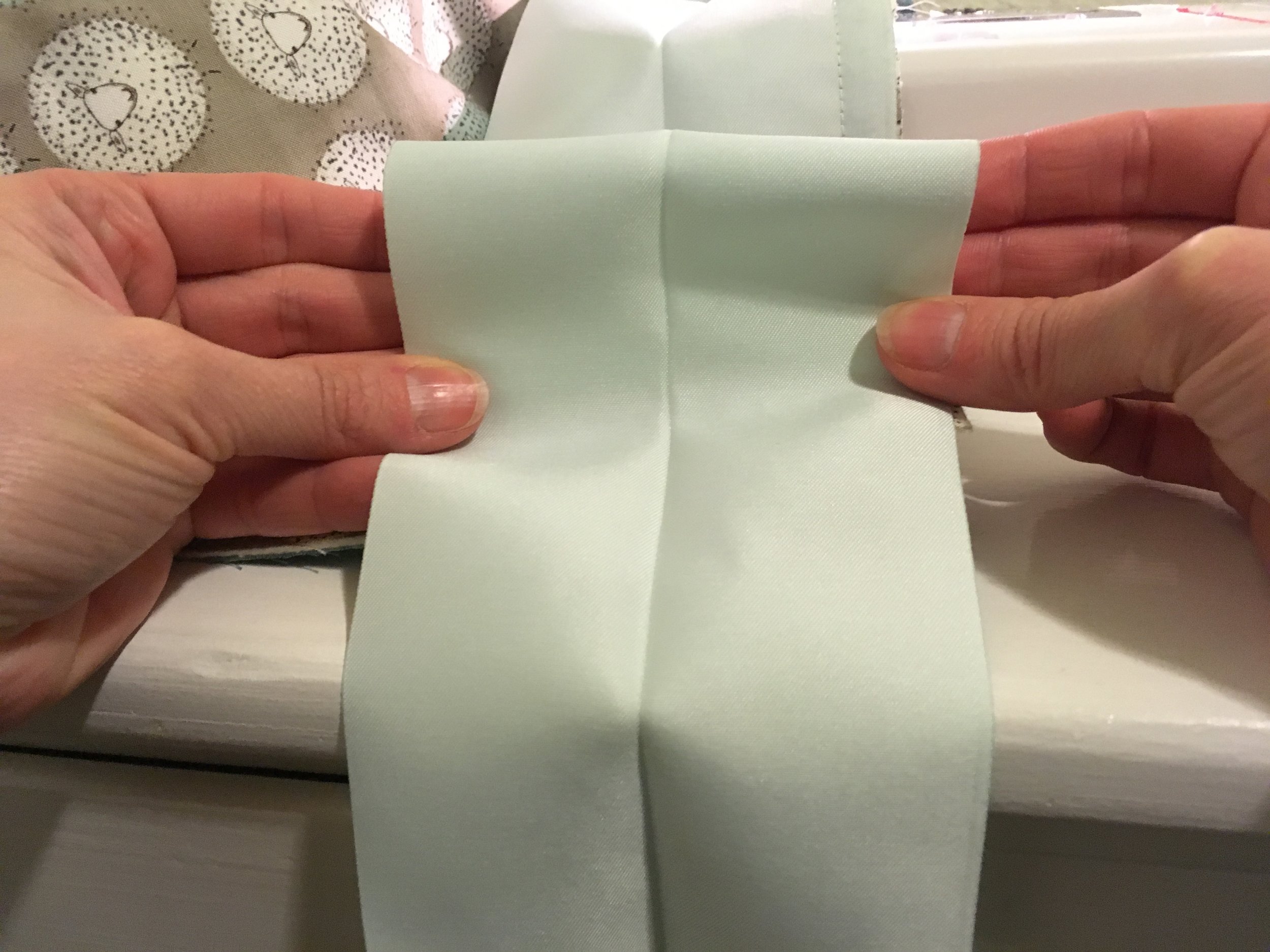 A Baby Quilt with Satin Binding Mitered Corners Bolt Fabric