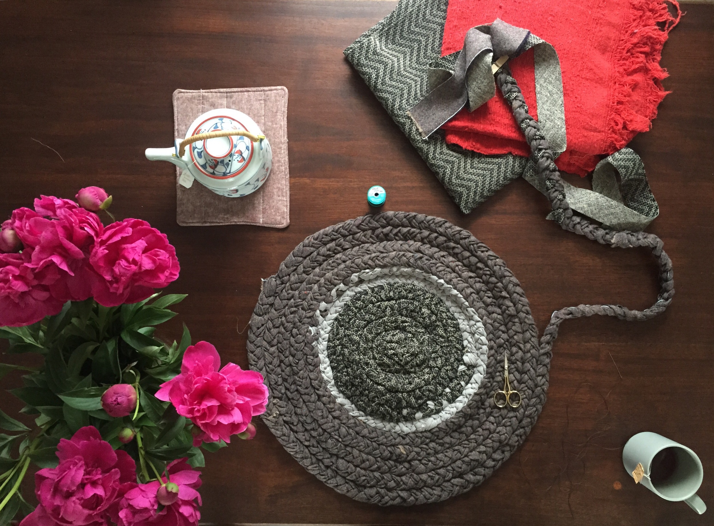 This rug consists of leftover fabric from recovering my couch and other scraps that I've been in love with too much to get rid of. 
