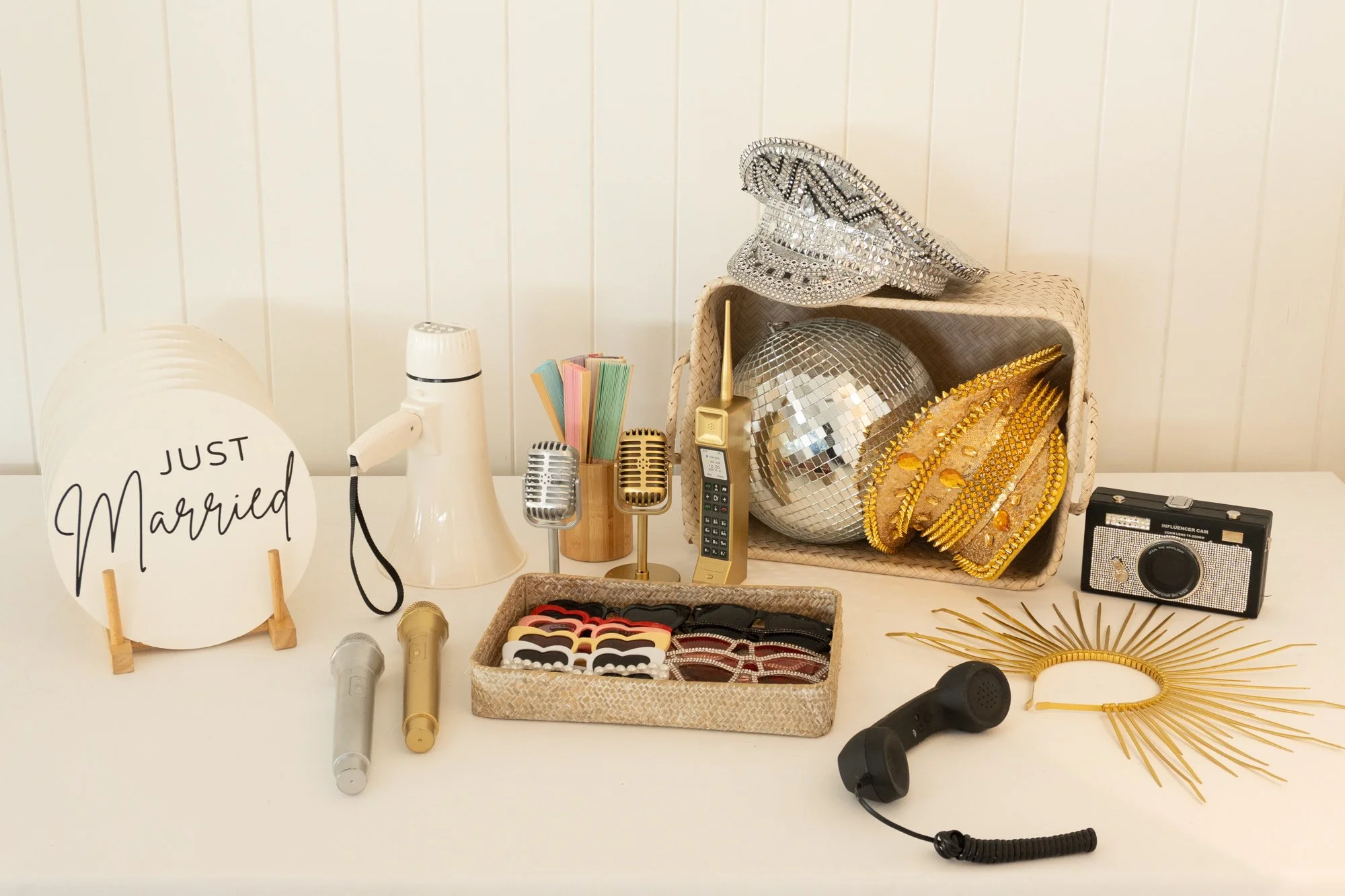 Curated photo booth props displayed in wooden baskets for wedding and event photo booth hire in Sydney.